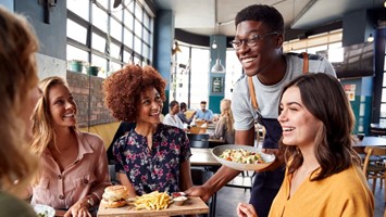 Waiter Serving Group Of Female Friends Meeting For Drinks And Food In Picture Id1146671798 (1)